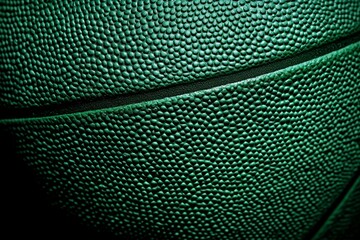 Intricate green basketball surface ideal for sports designs.