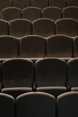 Obraz premium Chairs upholstered in gray beige textiles in the concert hall