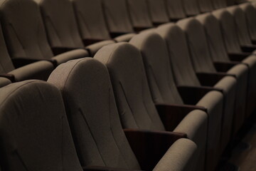 Fototapeta premium Chairs upholstered in gray beige textiles in the concert hall