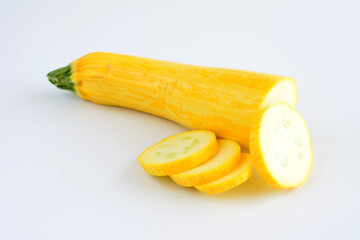 Sliced yellow squash on a white background