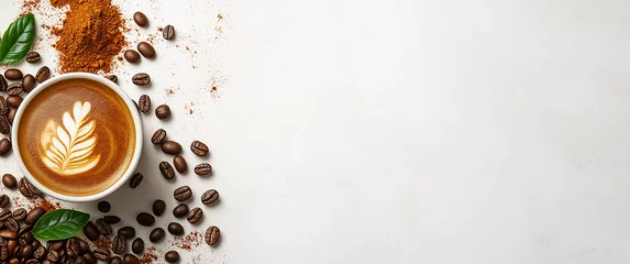 Top view of coffee cup and beans on white background with copy space