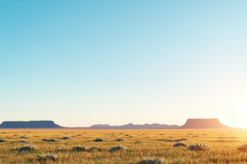 Obraz premium Vast desert landscape under clear blue sky with distant mesas an