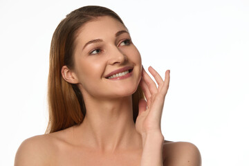 Smiling woman with smooth, spotless skin, looking upward, soft facial expression conveying...