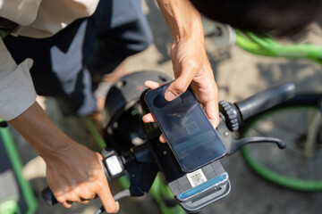 E-Bike Accessibility and Smart Solutions. A user engages with an e-bike app for sustainable transportation right from the bike.