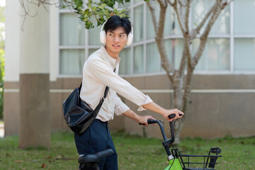Awareness and Mobility in Urban Landscapes. A person pauses on their bicycle, looking back in a...