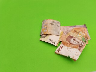 Indonesian Rupiah Money With different denomination isolated on green background