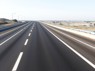 Fototapeta premium Asphalt Roadway Extends into the Distance