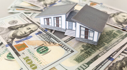 Background from money. Scattered dollars. paper house