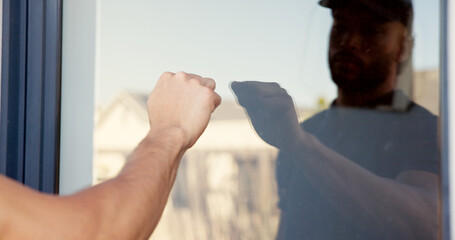 Hand, man and knocking on door of house for entrance, arrival alert and respect of visit homeowner. Guest, glass and reflection with announcement, show manners and attention for welcome permission