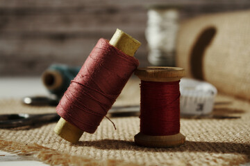 Sewing and tailoring concept. Two spools of thread next to each other