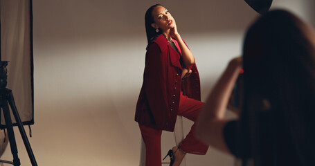 Woman, model and photoshoot for fashion in studio of media photography, clothes brand and...