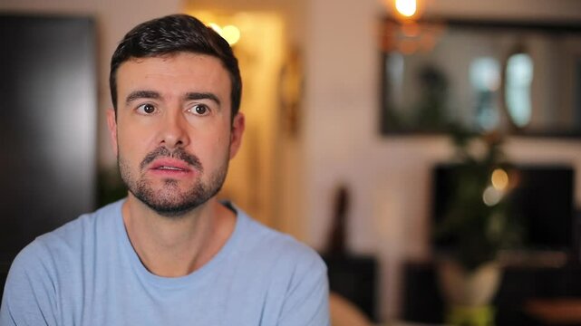 Unhappy man showing a fake smile 