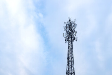 Communication signal tower with blue sky background