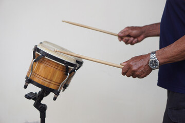 Close up man is beating the bongo drums. Concept, musical percussion instrument for rhythm of music...
