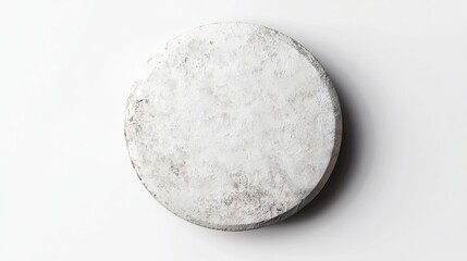 Top view of a round, off-white, textured disc.