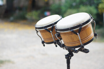 Bongo drums, outdoor background. Concept, musical instrument for rhythm of music to make more fun...