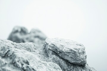 Fototapeta premium Close-up Stone Formation Displaying Rough Texture Against Soft Gray Backdrop