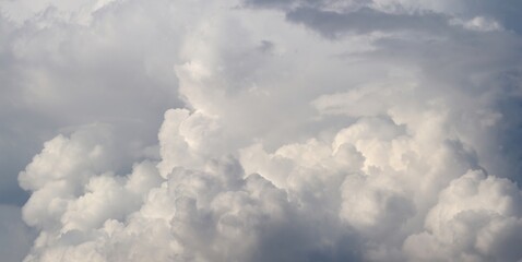 A close-up of the cloudy sky. Color background. Soft shapes. Simple composition. Abstract environment. Atmosphere of presence. Picture. Wallpaper. Poster. Postcard. Place to insert