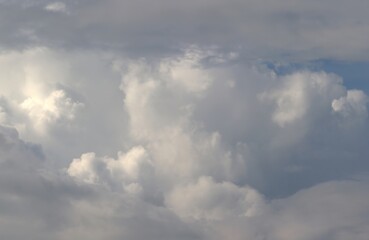 A close-up of the cloudy sky. Color background. Soft shapes. Simple composition. Abstract environment. Atmosphere of presence. Picture. Wallpaper. Poster. Postcard. Place to insert