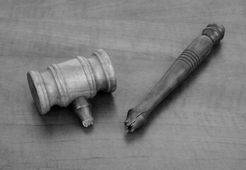 Broken wooden gavel on wooden table. 