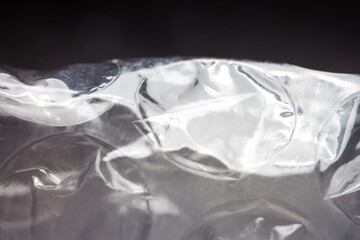 Extreme macro of plastic bubble wrap texture. Selective soft focus, shallow depth of field. Abstract dreamy background