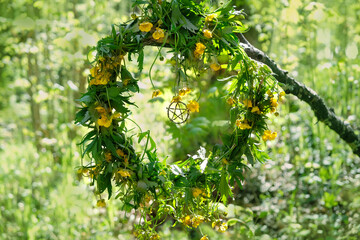 floral wreath with pentagram amulet in forest, green natural abstract background. wiccan magic ritual. Mysticism, occultism concept. witchcraft esoteric ritual for spring season. template for design
