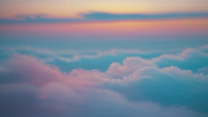 Obraz premium Vibrant pastel clouds fill the sky during sunset at a serene high altitude