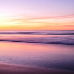 Obraz premium A serene beach at sunset with gentle waves washing ashore, reflecting soft pastel colors in the sky