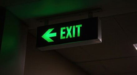 Glowing Exit Sign with Arrow Indicates Safety Route in Dark Environment
