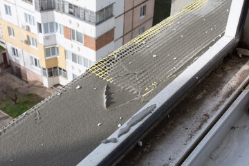 Facade mesh and plaster. Insulation of the facade of an apartment building. Preparing the facade for insulation with foam plastic. Selective focus, shallow depth of field
