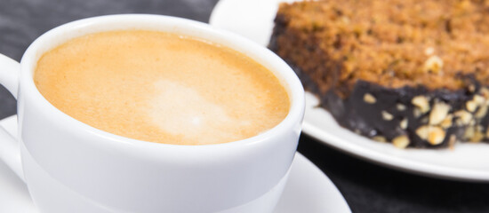 Fresh pastry made of zucchini and cup of white coffee. Delicious dessert