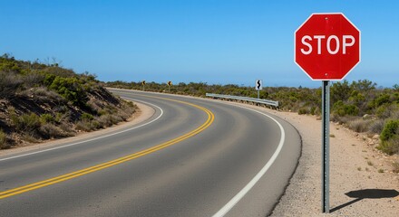Naklejka premium Driving Along Winding Road with Stop Sign and Blue Sky