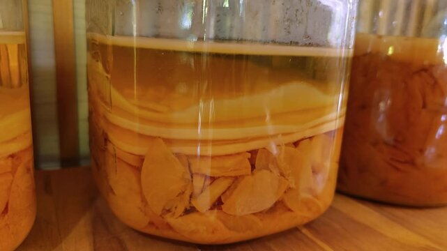 Fermented tea. Kombucha with scoby in a glass jar. 