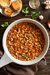 Macaroni with ground beef with vegetables in tomato sauce in skillet
