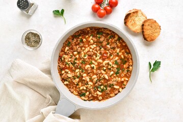 One pot meal with ground beef, pasta and vegetables simmered in