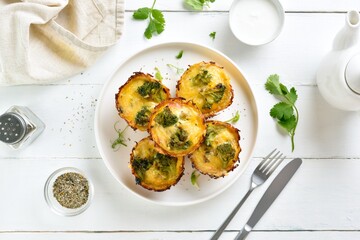 Dish for breakfast, healthy loaded egg muffins made with eggs, ham, broccoli, cheese