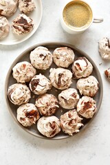 Chocolate meringue cookies and cup of coffee