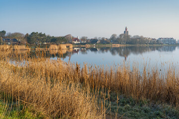 Romantic, foggy morning mood over the lake of Westkapelle, Netherlands