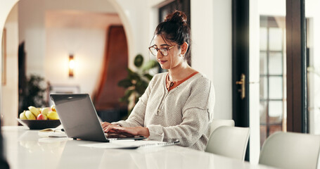 Laptop, typing and woman in home for freelance accounting or revenue audit. Computer, remote work...