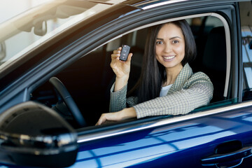 Buying New Car. Happy Young Woman Showing Keys Of Her Automobile Out Of Window, Beautiful Female...