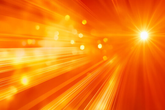 Abstract sparkling and glowing golden-orange background with lens flare and sunbeams.