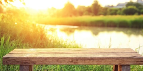 Serene wooden bench by a tranquil lake at sunset