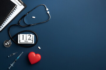 Red heart with doctor stethoscope, medical instruments and notebook on blue background, hospital...