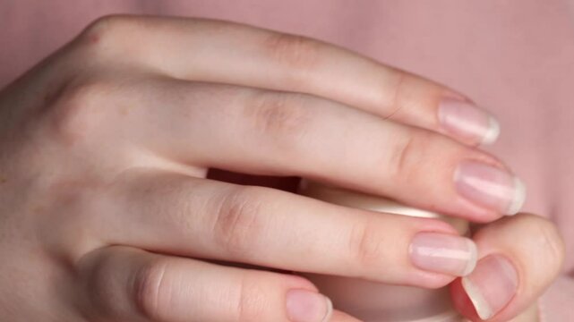 opening a skincare jar with acid-based cream. close-up of female hands twisting the lid of a cosmetic container. concept of skin hydration, whitening treatment, and beauty care