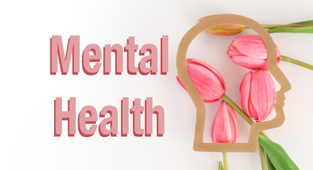 A pink flower with a head on it with the words mental health written below it