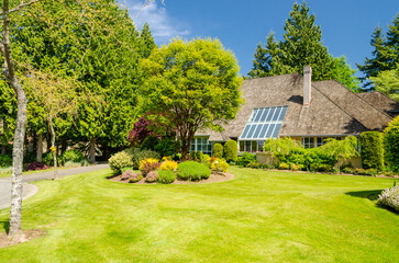 Two story luxury house with beautiful summer  landscape in Vancouver, Canada, North America. Day...