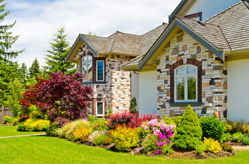 Two story luxury house with beautiful summer  landscape in Vancouver, Canada, North America. Day...