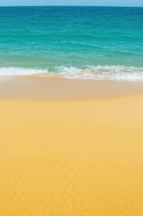 Naklejka premium Serene Beach Scene Golden Sand, Turquoise Ocean, And Clear Coastal Sky Colorful Paradise On Shore Where Gentle Waves Meet Beautiful Sky