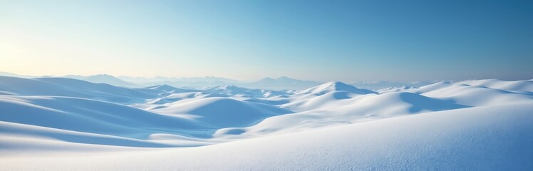 Winter landscape of rolling white snow hills under vibrant blue sky. Serene scenery, peaceful environment. Cold, frosty, clear day. Tranquil nature escape, travel destination, perfect for relaxation.