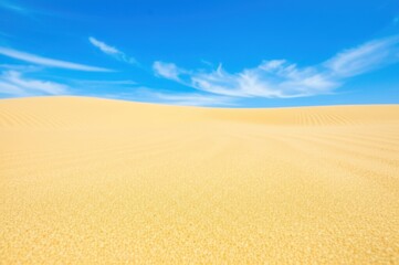 Golden Sand Desert Landscape Capturing Serene Isolation Depth Of Vast Environment Under Clear Sky Warm Color And Tone Highlight Fine Sand Textures Against Blue Background